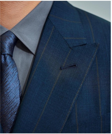 Classic combination of navy blue suit with grey shirt and blue tie.